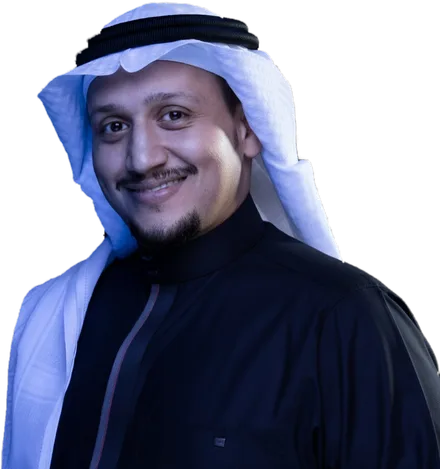 د. نايف البار مبتسمًا بالبشت والغترة